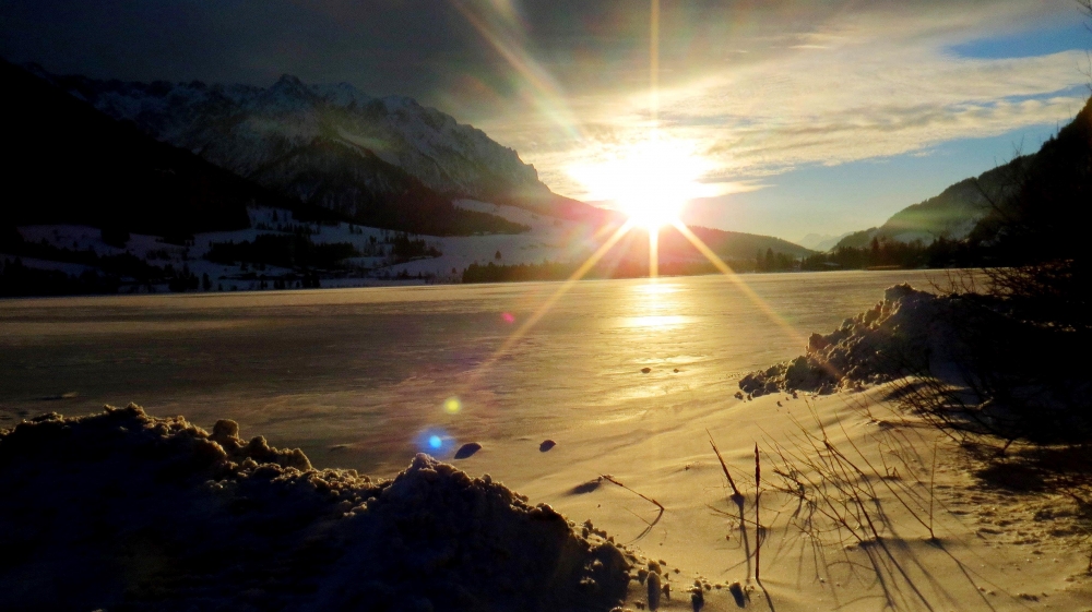 Sunset on the ice lake